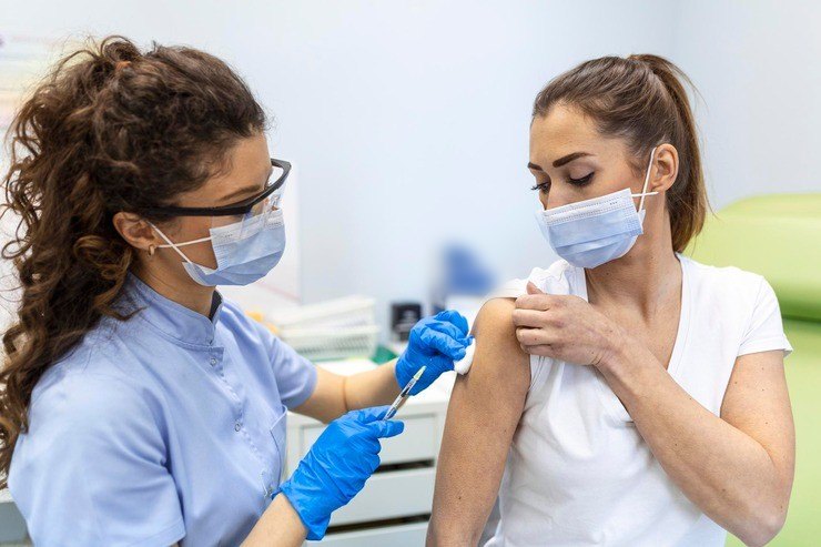 Nurse giving a patient a vaccination